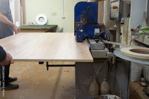 process of sawing wood with a circular saw. Machine for wood cutting MDF and particle Board or chipboard for the manufacture of details of furniture.