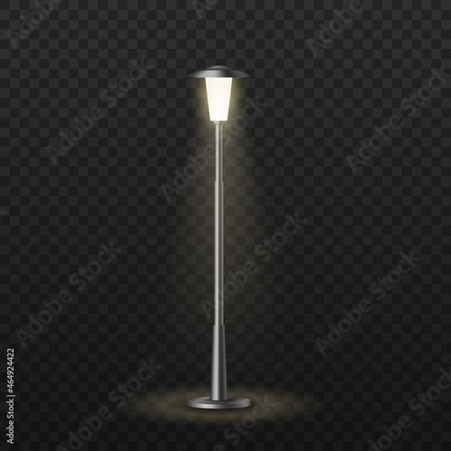 Realistic city street light glowing in darkness yellow warm light. Old-fashioned, retro lamppost