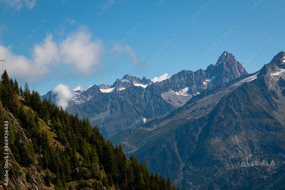The view from a hiking trail between Refuge de Bellachat and Les Houches (near Chamonix) towards the Massif du Mont Blanc, French Alps. September 2021