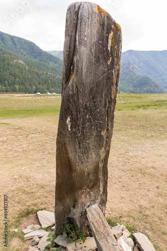 Ancient Deer stone with primitive drawings on it and damage by modern vandals scratching the surface of cultural heritage objects photo