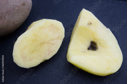 Cut potatoes with light and dark stripes inside (Candidatus Liberibacter solanacearum)
