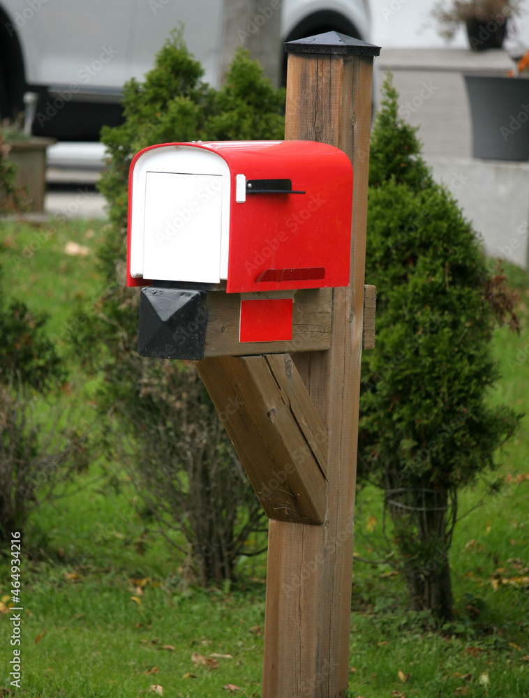 Red and white mailbox in rural countryside Red and white mailbox in rural countryside