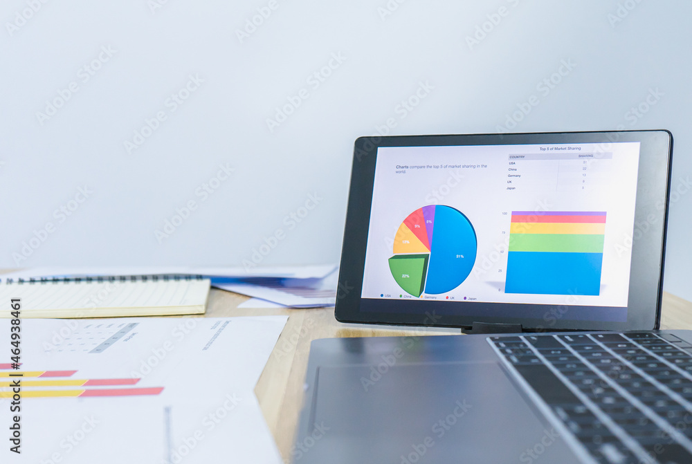 business data graph on tablet with left white copy space background business data graph on tablet with left white copy space background