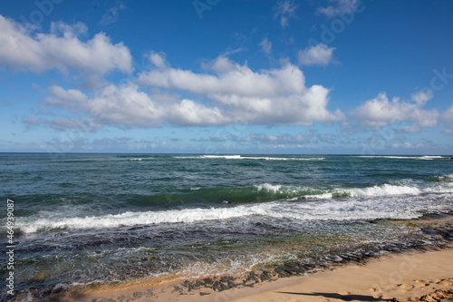 Ocean. waves and cloudy blue sky