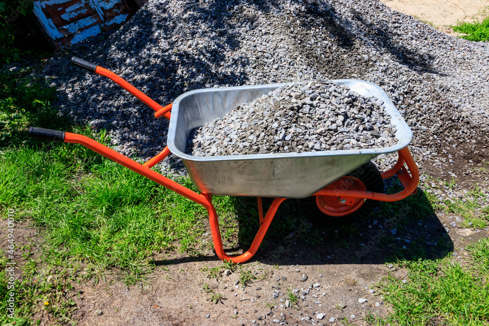 Wheelbarrow with gravel at the construction site Stock Photo Adobe Stock