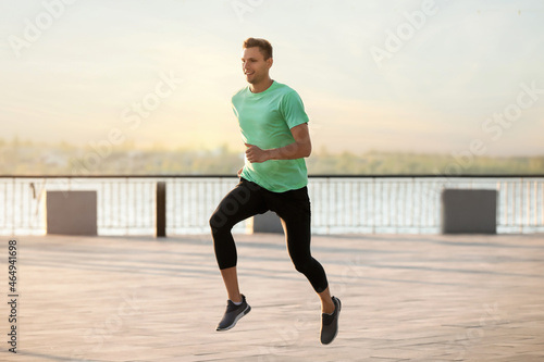 Handsome young man running ...