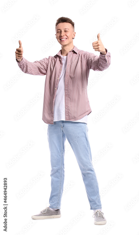 Young man in striped shirt showing thumbs-up on white background Young man in striped shirt showing thumbs-up on white background