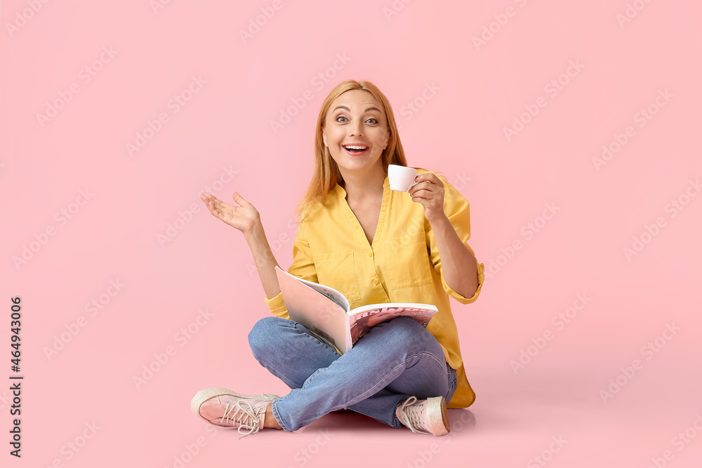 Surprised mature woman with cup of coffee and magazine on color background Surprised mature woman with cup of coffee and magazine on color background