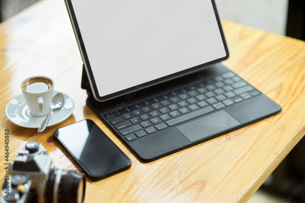 Close-up freelancer or photographer portable workplace concept, tablet mockup Close-up freelancer or photographer portable workplace concept, tablet mockup
