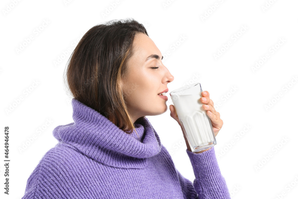 Young woman drinking fresh milk on white background Young woman drinking fresh milk on white background