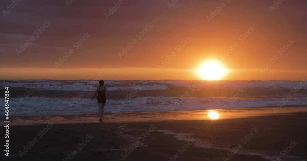 Running to an early morning swim in the ocean as the sun rises Running to an early morning swim in the ocean as the sun rises