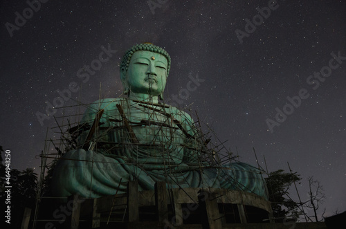Daibutsu or  Giant Buddha  is a Japanese term often used informally for a large statue of Buddha  Time lapse Giant Buddha with milky way moving in sky at night  Mae Tha District  Lampang Province.