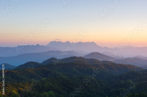 Aerial View of Doi chiang dao mountains in the morning and the sea of mist, Doi Kham Fa. Chiang Mai Province, Thailand. Pink cherry blossom.