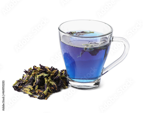 Cup of butterfly pea flower tea on white background photo