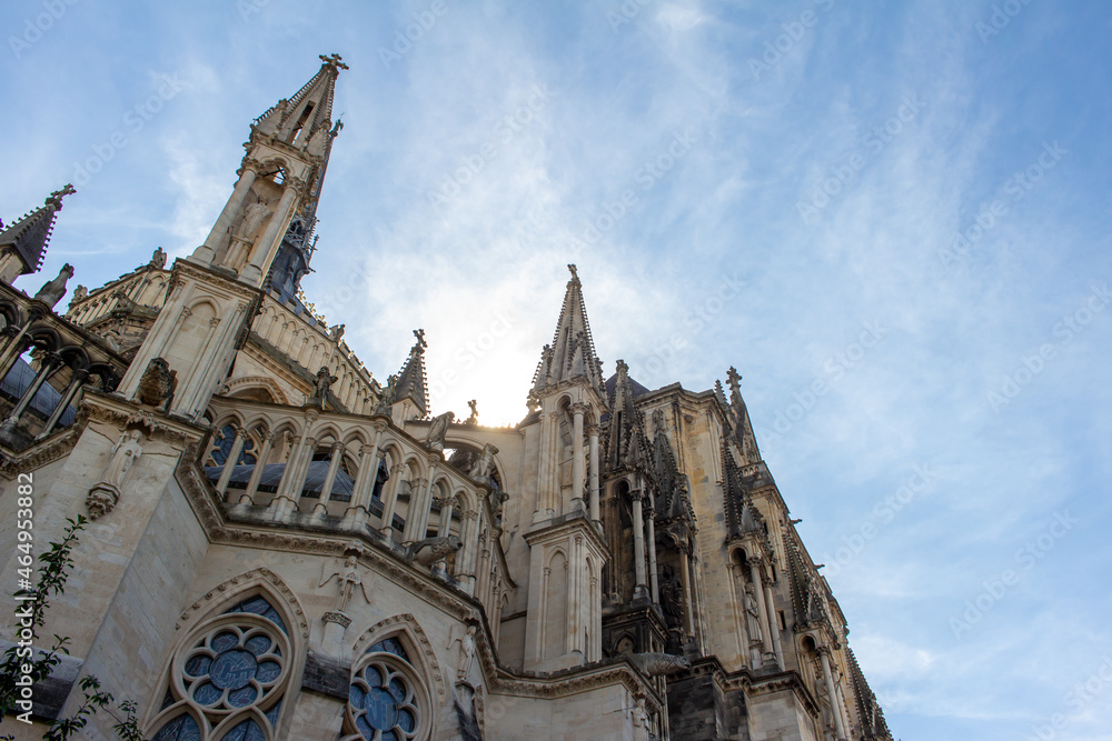Close up exterior view of the ornate medieval Our Lady of Reims Cathedral (Notre-Dame de Reims) in France, with high Gothic architecture, showing a view of its apse