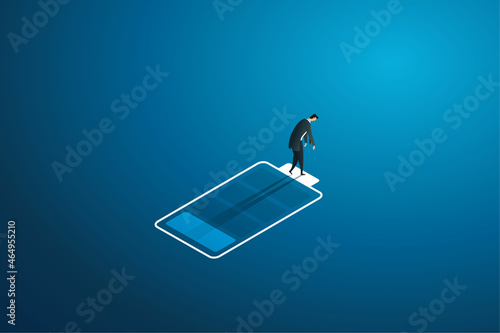 Businessman walking on icon low battery.