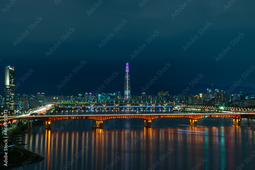 Night view of Lotte tower the fifth tallest building skyscraper in the world along with Han Gang river of Seoul South Korea
