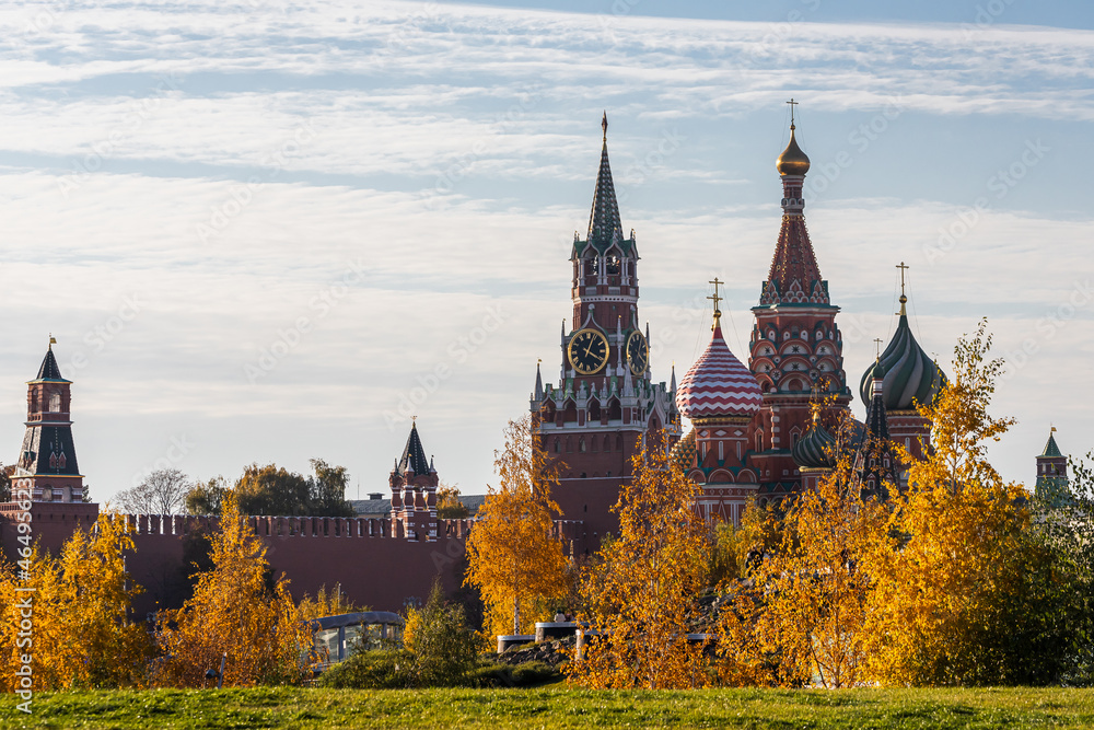 Kremlin's Spasskaya Tower and St. Basil's Cathedral on Red Square on an autumn day