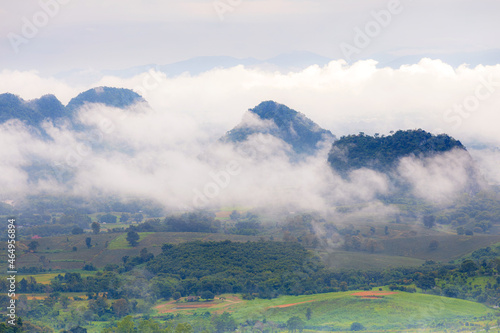Aerial view of Sun rise with fog Over City and mountain range at Chiangrai Thailand, date photo taken 20 October 2021
