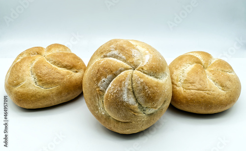Fresh Kaiser rolls baked bread. Kaiser is a type of round, hard, and crunchy bread originally from Austria, often used to make sandwiches.
