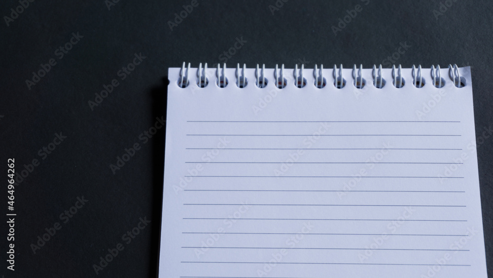 minimal work space, top view of note book on black background. note book copy space and text space minimal work space, top view of note book on black background. note book copy space and text space