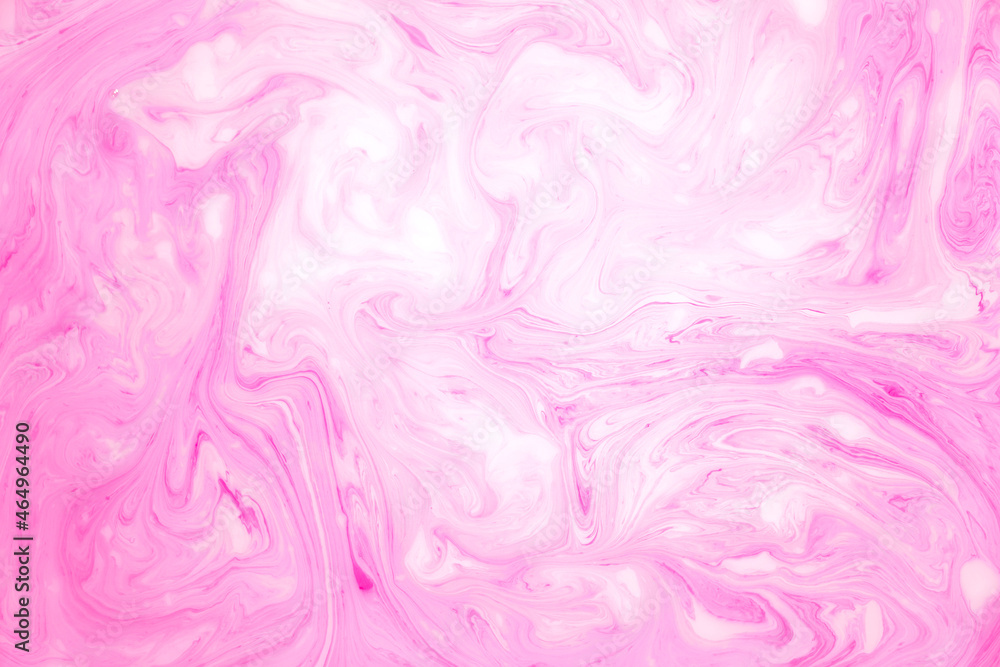 Abstract colored marble background, stains of pink paint on the surface of the water. Liquid colorful backdrop. Abstract colored marble background, stains of pink paint on the surface of the water. Liquid colorful backdrop.