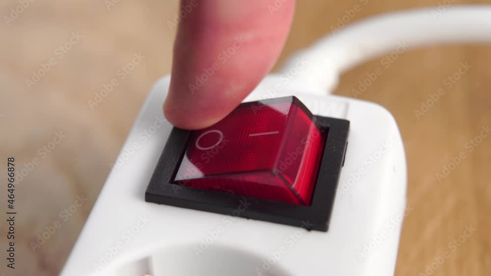 Disconnecting an electrical power strip by pressing a red switch close