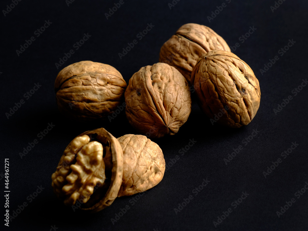 walnuts (akhrot) on black background, Dry fruits, walnut or akhrot well known dried fruit having shape like brain. walnuts (akhrot) on black background, Dry fruits, walnut or akhrot well known dried fruit having shape like brain.
