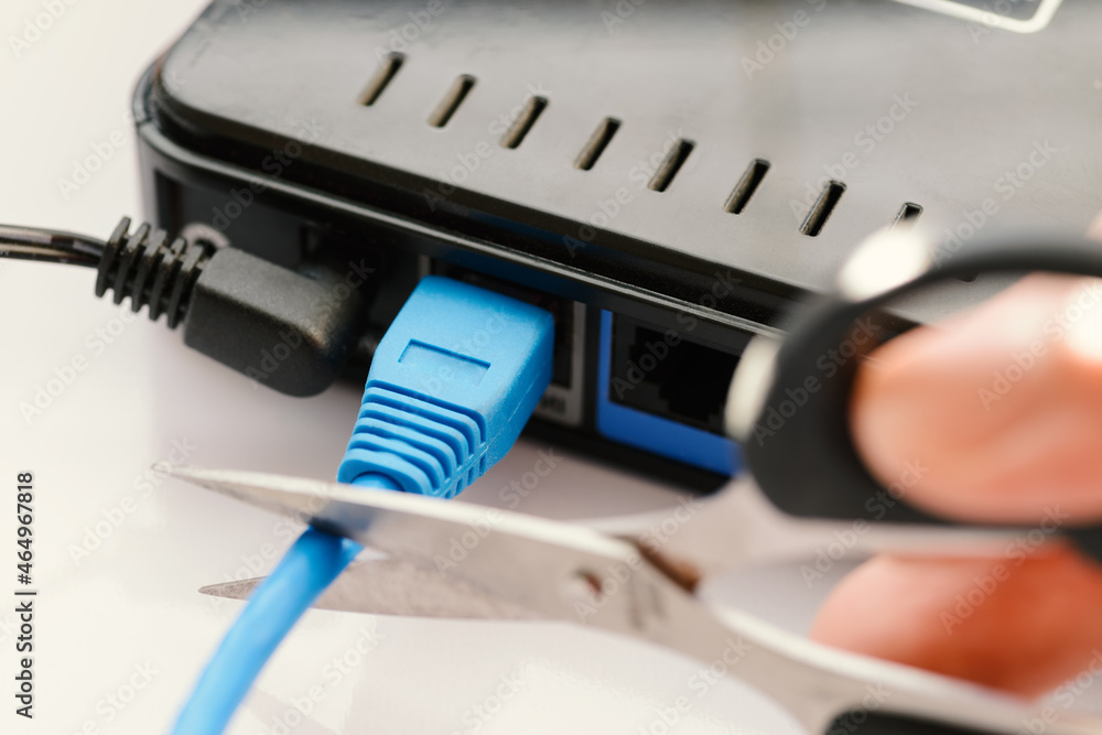 Scissors cutting LAN cable - no more internet. Scissors cutting LAN cable - no more internet.