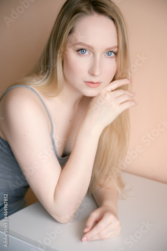Portrait of a beautiful young woman with blue eyes.
