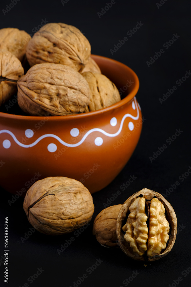 walnuts (akhrot) on black background, Dry fruits, walnut or akhrot well known dried fruit having shape like brain. walnuts (akhrot) on black background, Dry fruits, walnut or akhrot well known dried fruit having shape like brain.