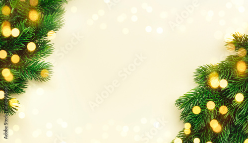 Christmas and New Year background with green spruce branches  light banner  top view  copy space