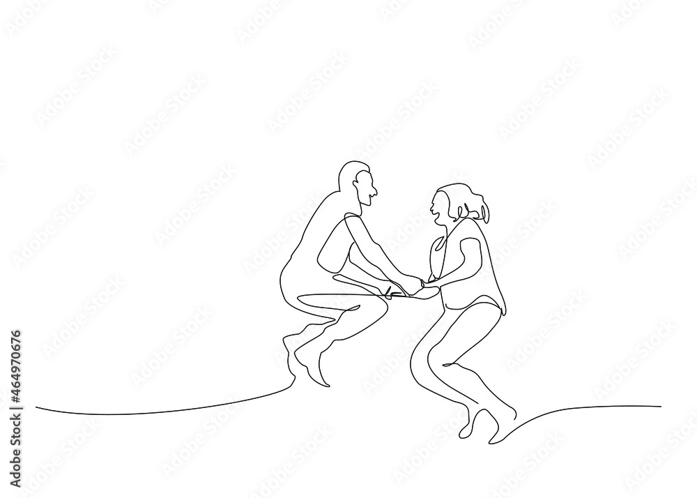 Mature couple having fun together. couple in love jumping in the air holding hands
