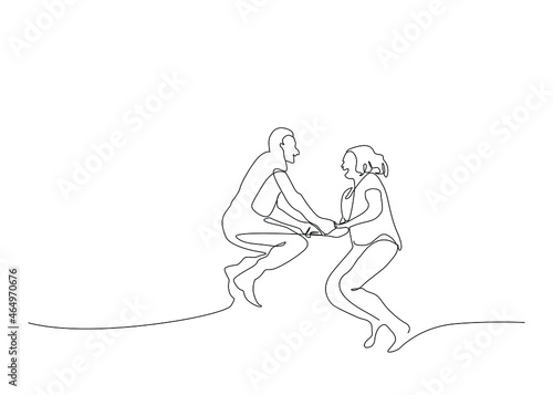 Mature couple having fun together. couple in love jumping in the air holding hands
