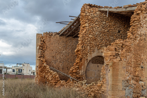 Typical rural house of the island of Mallorca, made of stone and in a state of abandonment. Image of the abandonment of the rural world photo