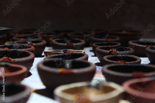 Artistic homemade clay oil lamps or karthikai deepam are ready for diwali and karthikai festivals photo