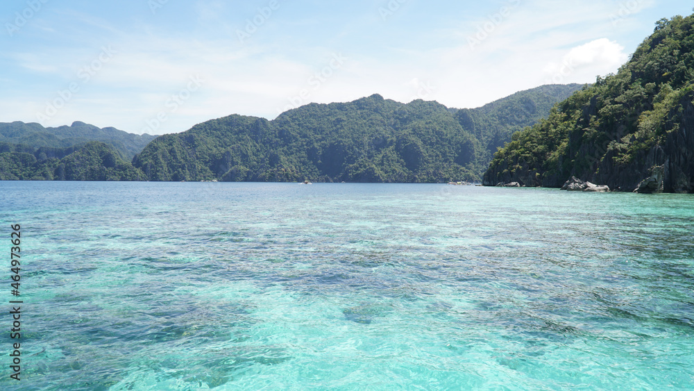 Ocean and jagged rock landscapes with turquoise water at Coron Island in Palawan, Philippines.