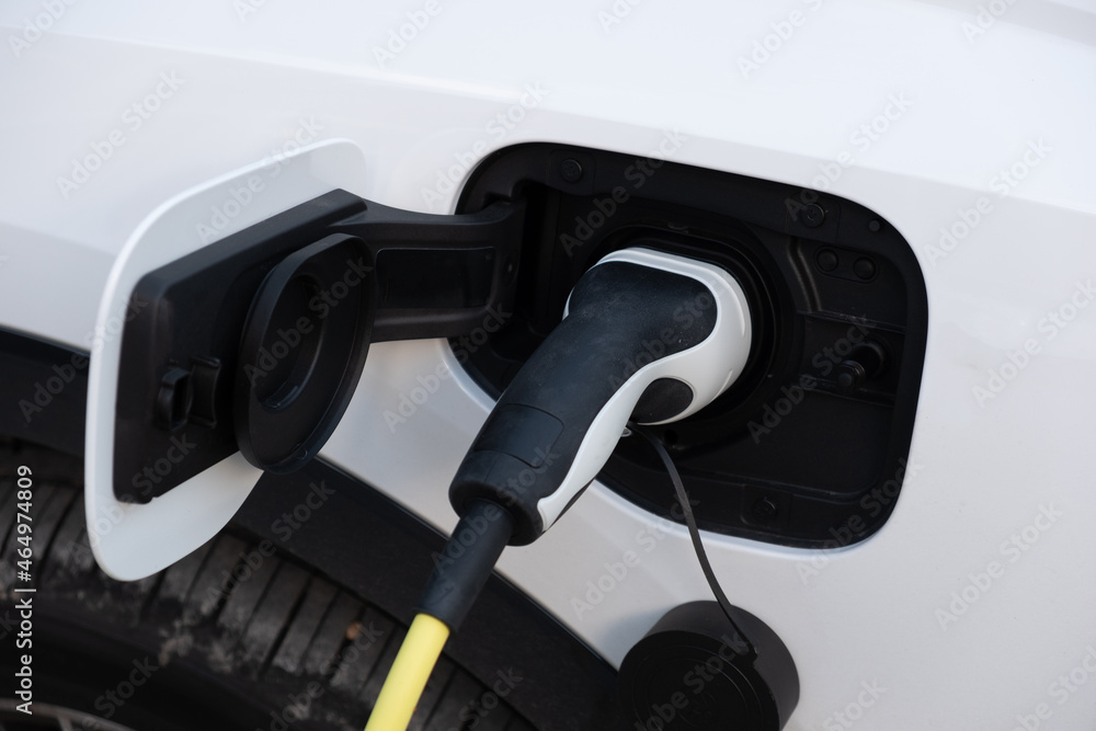 Charging an electric car battery. Mobility environment friendly Charging an electric car battery. Mobility environment friendly
