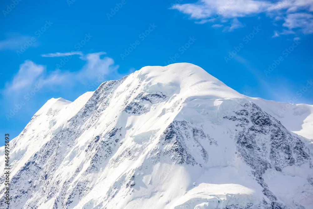 
Mountaineerin, Breithorn, West Alps, Swiss. Monte Rosa peaks.
