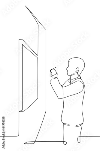 man photographs a picture on the phone - one line drawing vector. man takes a mobile horizontal photograph of a picture in a frame hanging on a wall