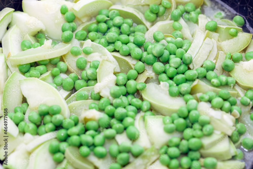Stewed zucchini with peas . Tasty meal for vegetarians Stewed zucchini with peas . Tasty meal for vegetarians