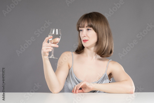 Woman is drinking light win...