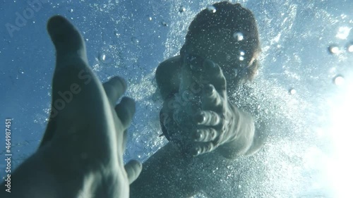 Emotional Female Savior Saving Drowning Man Underwater Shooting. Woman Rescuer. Hope Concept