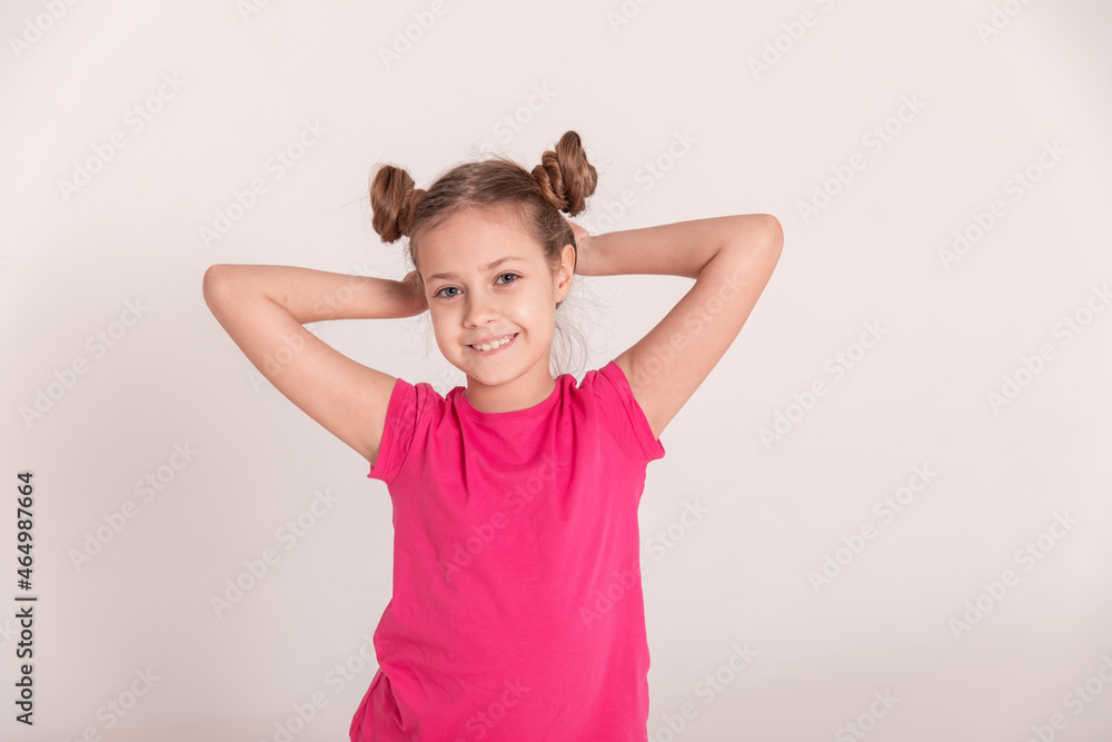 portrait of a beautiful girl with tails in pink clothes on a white isolated background portrait of a beautiful girl with tails in pink clothes on a white isolated background