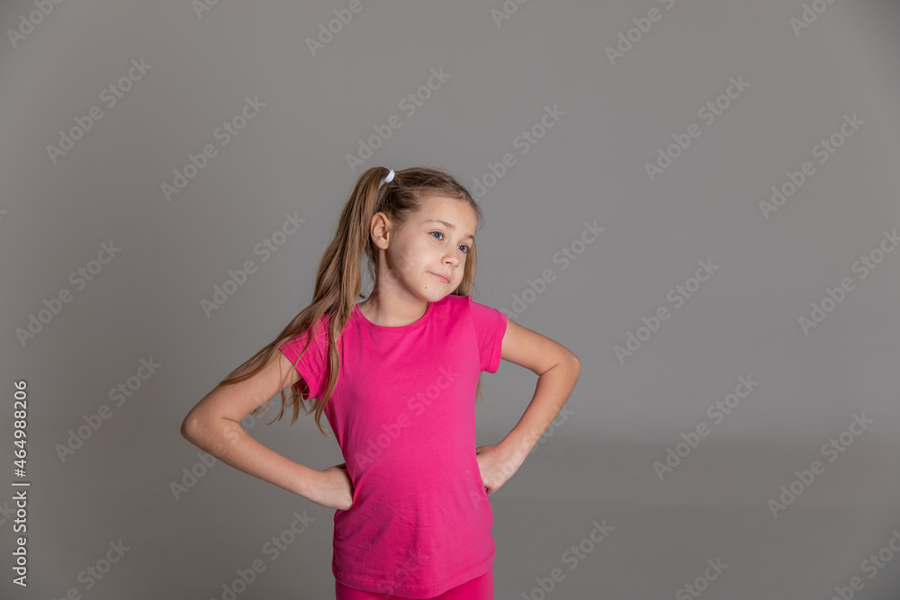 portrait of a beautiful happy girl with tails in a pink T-shirt portrait of a beautiful happy girl with tails in a pink T-shirt