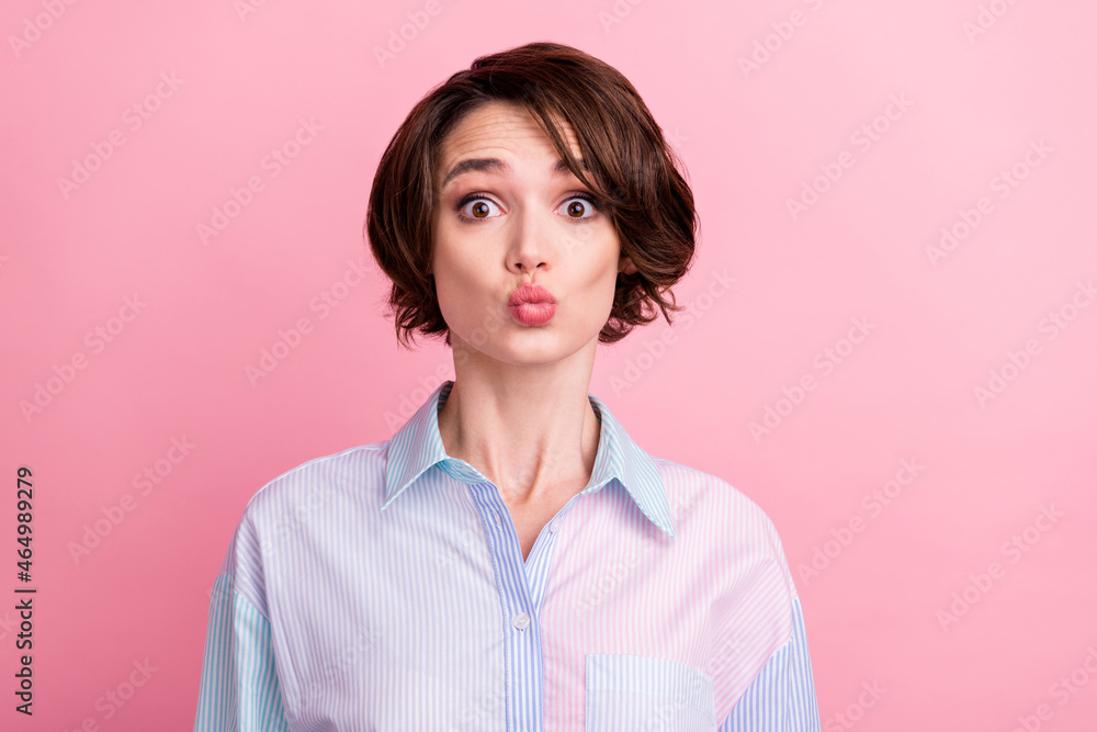 Fototapeta premium Photo portrait amazed woman sending air kiss on date isolated pastel pink color background