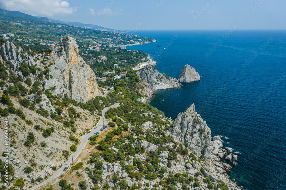 Aerial view of beautiful landscape of Simeiz area. Cat mountain, Diva and Penea, Swan Wing Rocks, coastline with beach. Crimea