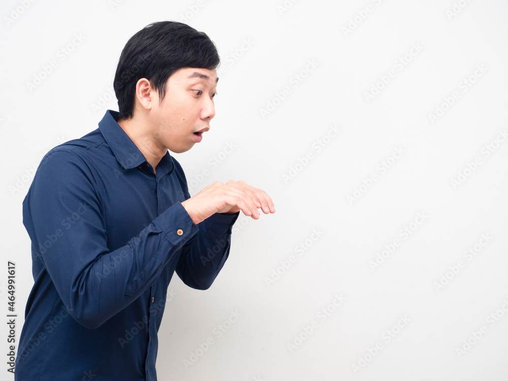 Asian man gesture peeking something copy space Asian man gesture peeking something copy space