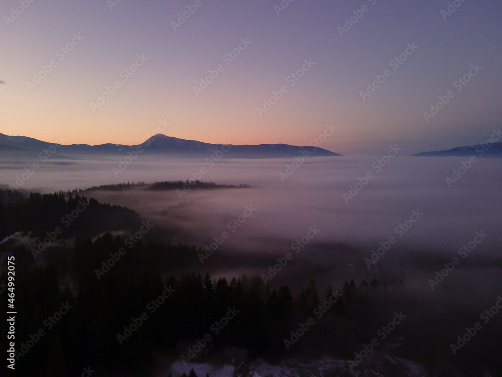 aerial view of sunrise in winter mountains