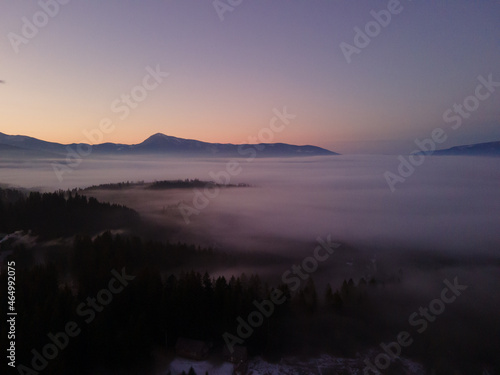 aerial view of sunrise in winter mountains